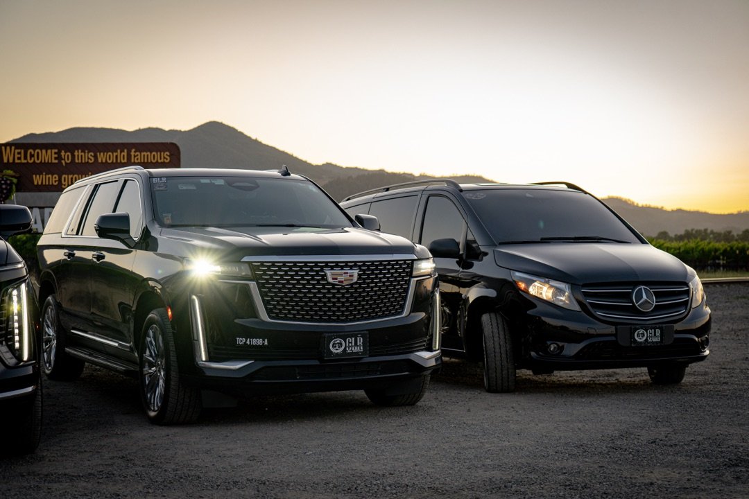 Escalade and Mercedes at sunset in wine country